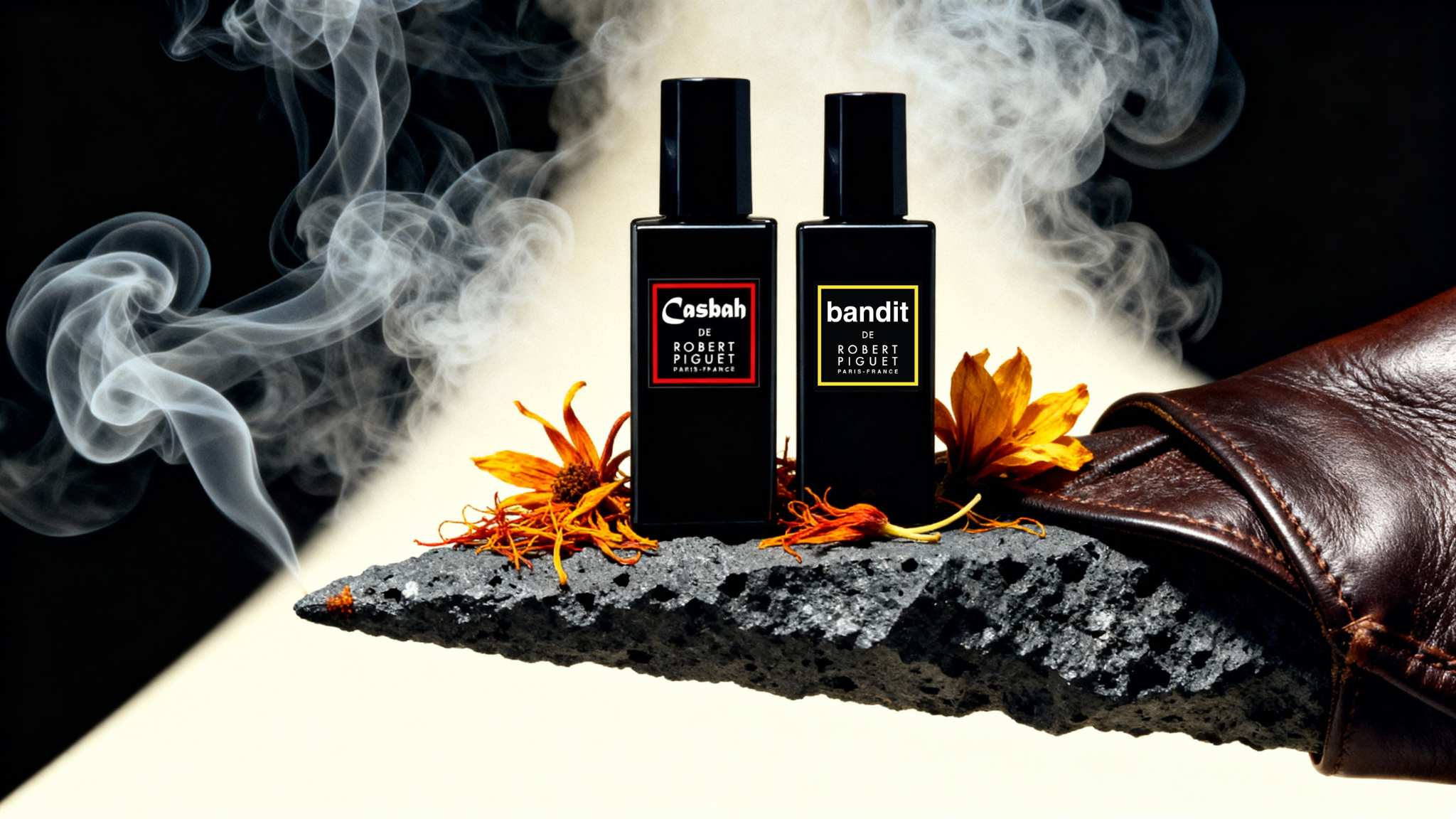 Casbah and Bandit bottles surrounded by smoke, leather and saffron flowers