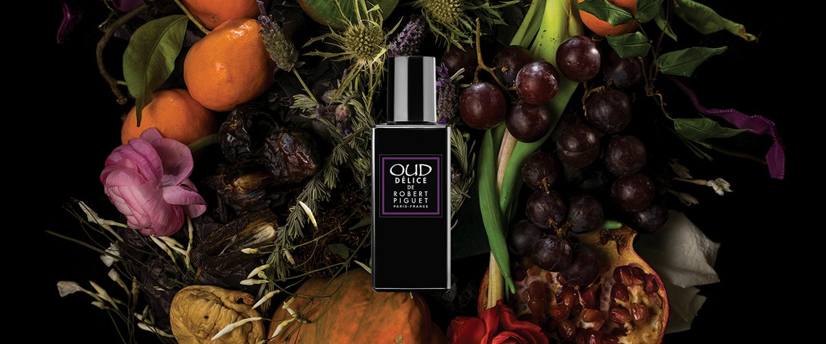 Oud Delice bottle on fruit background